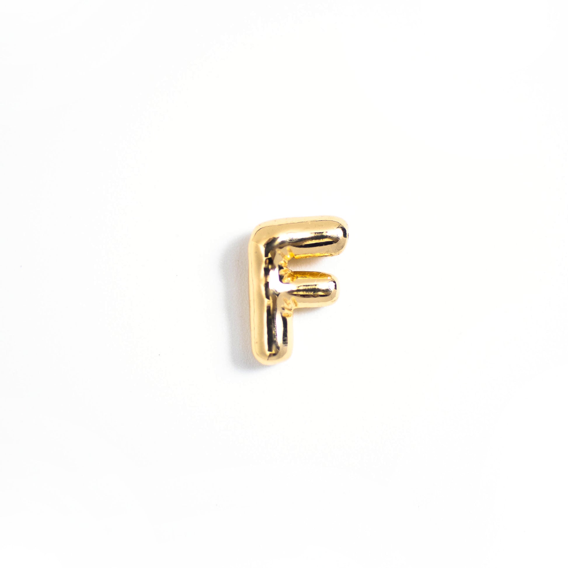 This photo features with a mini F letter pendant.