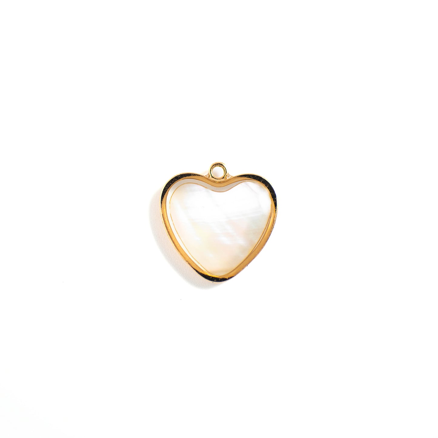 This photo features with a heart-shaped pendant made of pearl paper.