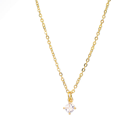 This photo features a thin chain necklace made of 14K gold-plated sterling silver, paired with Round Zircon Necklace