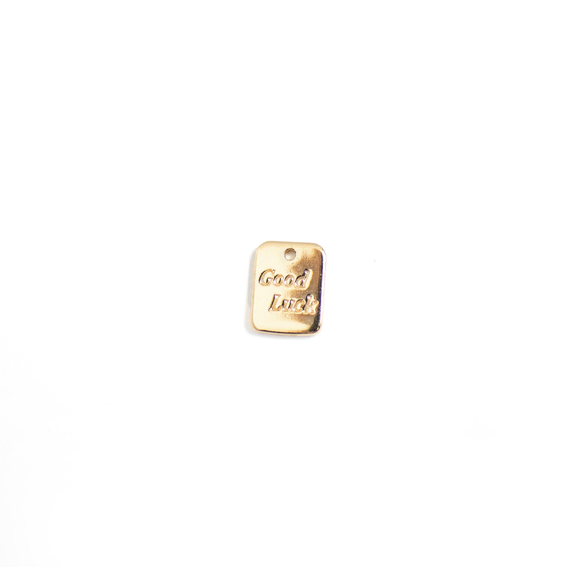 This photo features with a rectangular tag pendant with the words 'good luck'.