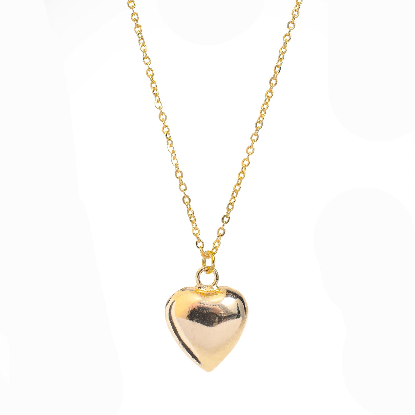 This photo features a thin chain necklace made of 14K gold-plated sterling silver, paired with a hollow heart-shaped charm.