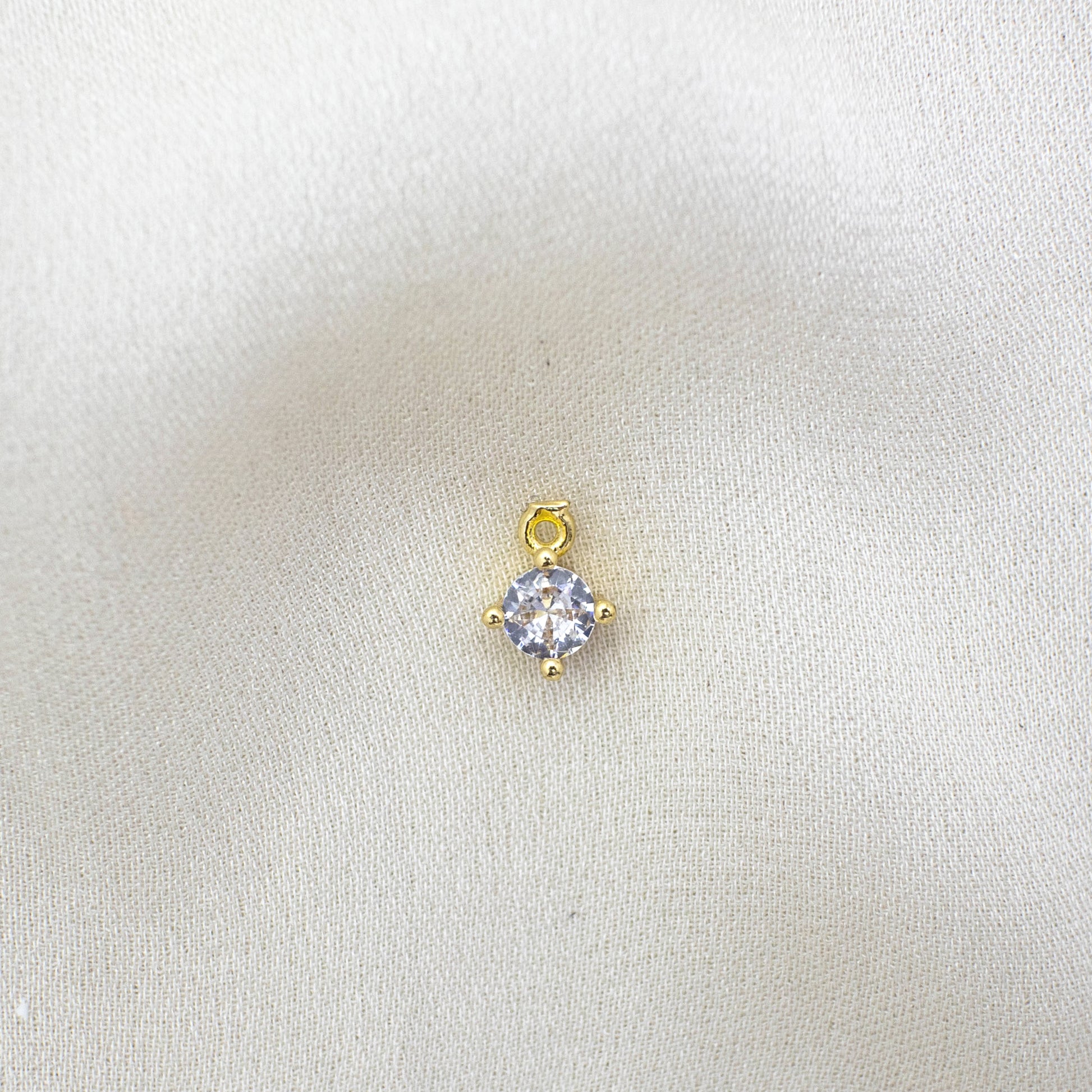 This photo features with a Round Zircon Charm