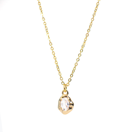 This photo features a thin chain necklace made of 14K gold-plated sterling silver, paired with a irregularly zircon.