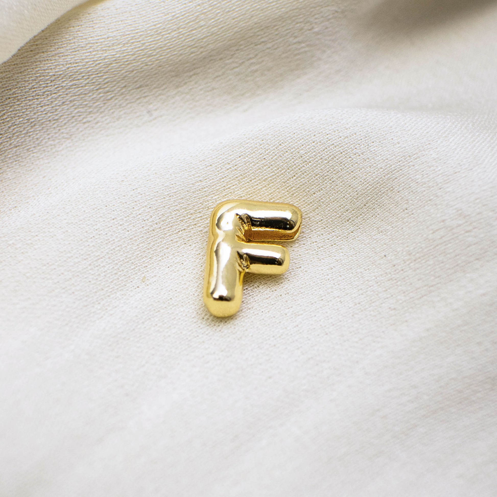 This photo features with a mini F letter pendant.