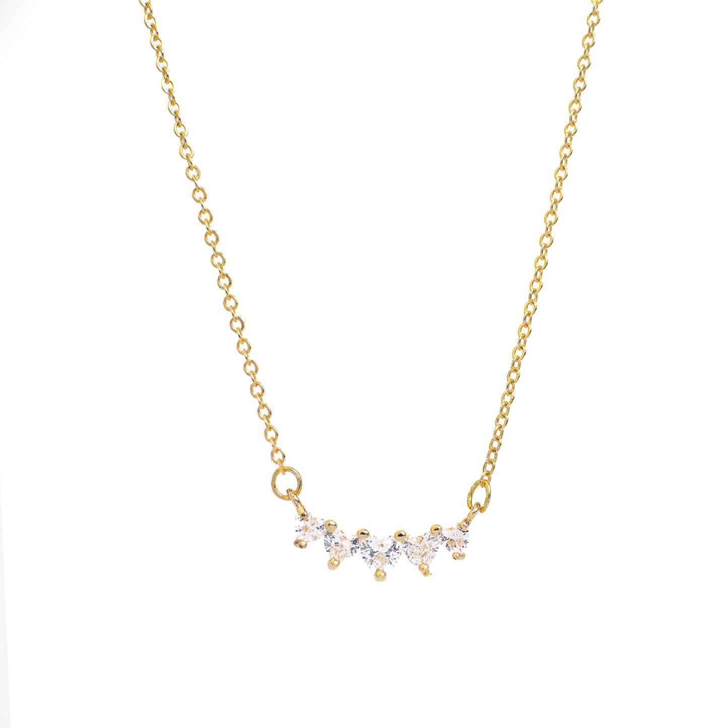 This photo features a thin chain necklace made of 14K gold-plated sterling silver, paired with a rectangular tag pendant with Five Zircon Heart Necklace